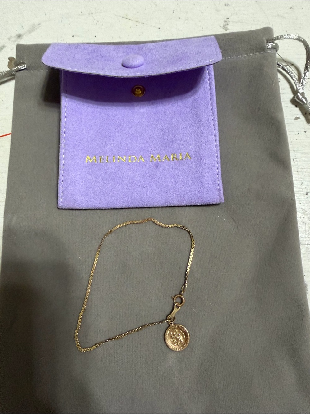 Melinda Maria Gold Coin bracelet with Purple Suede Pouch never worn